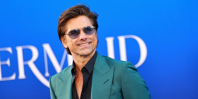 John Stamos at a movie premiere