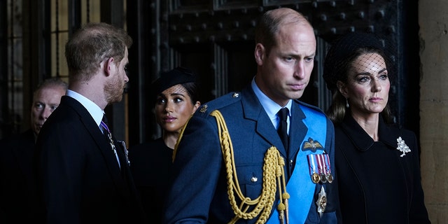 Prince Harry, Meghan Markle, Prince William and Kate Middleton looking somber in the dark