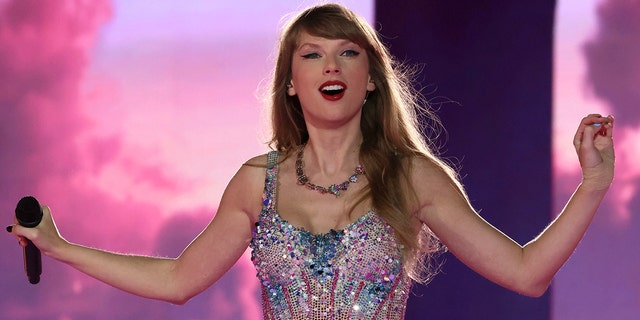 Taylor Swift wears sparkling rhinestone costume while performing during The Eras Tour