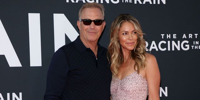 Kevin Costner and his wife Christine Baumgartner at film premiere