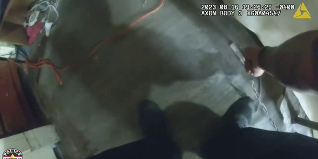 officer finding chain bolted to floor