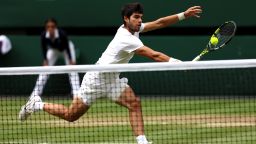 Carlos Alcaraz of Spain plays a backhand in the Men's Singles Final against Novak Djokovic of Serbia on day fourteen of The Championships Wimbledon 2023 at All England Lawn Tennis and Croquet Club on July 16, 2023 in London, England.