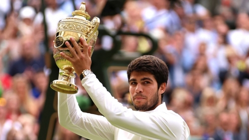 Carlos Alcaraz of Spain lifts the Men's Singles Trophy following his victory in the Men's Singles Final against Novak Djokovic of Serbia on day fourteen of The Championships Wimbledon 2023 at All England Lawn Tennis and Croquet Club on July 16, 2023 in London, England.