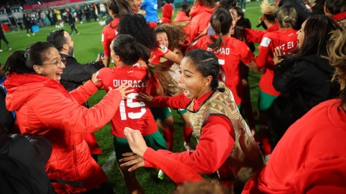 Morocco players celebrate reaching the last 16 of the Women's World Cup.