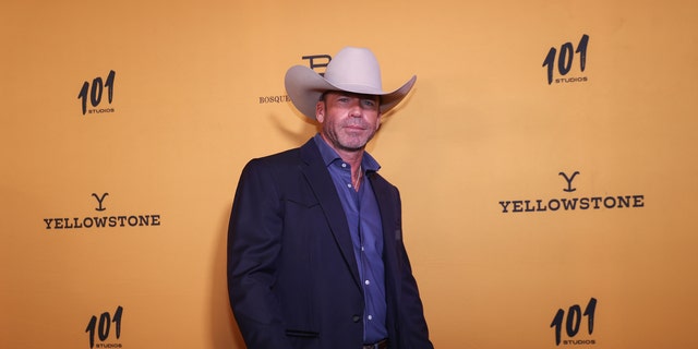 Taylor Sheridan in a cowboy hat on the red carpet
