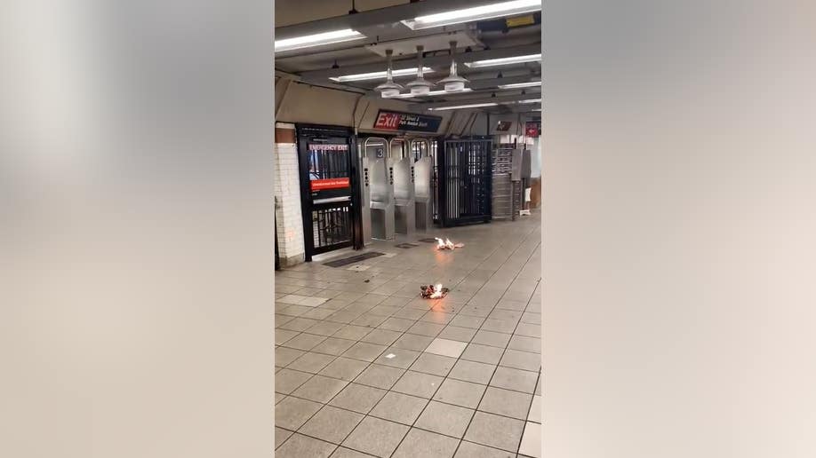 newspapers burning on subway platform