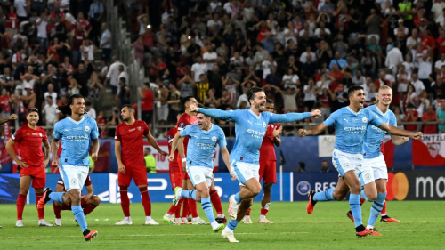 Manchester City's players celebrate victory after the penalty shootout of the 2023 UEFA Super Cup football match between Manchester City and Sevilla at the Georgios Karaiskakis Stadium in Piraeus on August 16, 2023. (Photo by Aris MESSINIS / AFP) (Photo by ARIS MESSINIS/AFP via Getty Images)