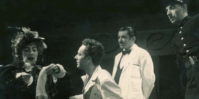 A young Alan Shayne performing on stage with an actor and actress wearing a white shirt