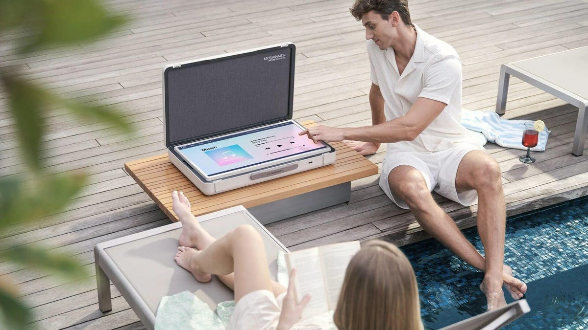 Two people on a deck with their LG StanByMe Go