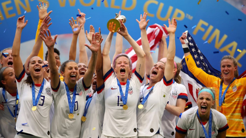 LYON, FRANCE - JULY 07: Megan Rapinoe of the USA lifts the trophy as USA celebrate victory during the 2019 FIFA Women's World Cup France Final match between The United State of America and The Netherlands at Stade de Lyon on July 07, 2019 in Lyon, France. (Photo by Richard Heathcote/Getty Images)
