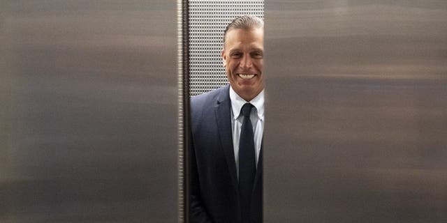 Devon Archer gets into an elevator