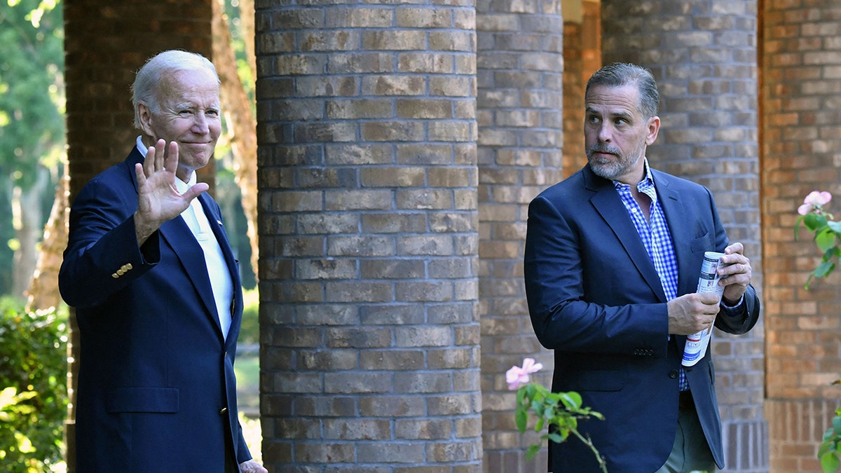 Joe Biden waving with Hunter Biden