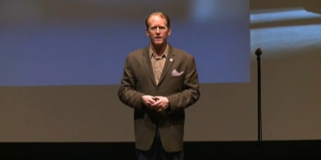 ONeill speaking at a conference.