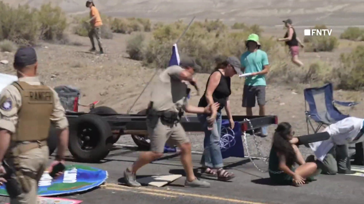 Nevada police draws gun while arresting climate protester