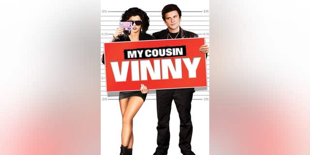 Cover of "My Cousin Vinny" with characters holding sign.