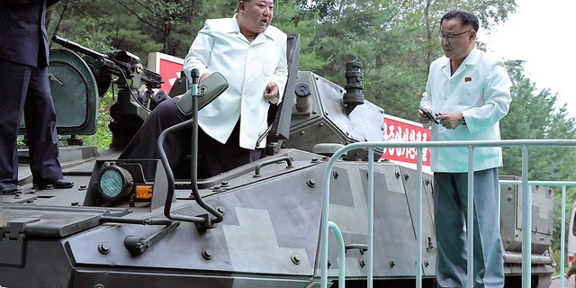 Kim Jong-Un on a vehicle