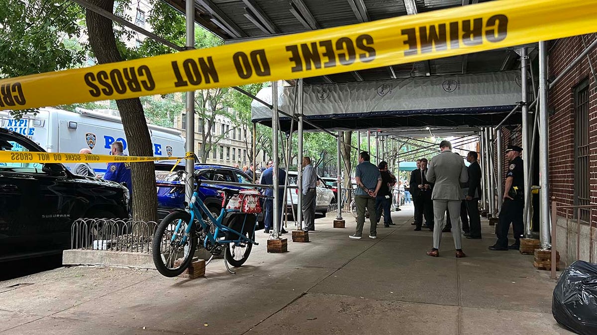 Investigators cordon off an apartment building in New York City’s Upper West Side