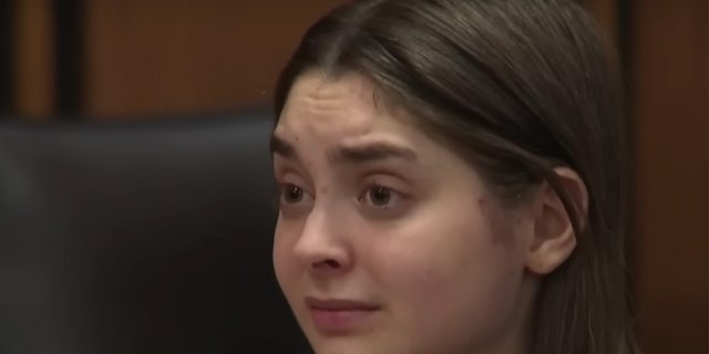 Ohio woman looks emotion in a close up in court.