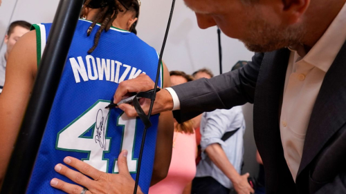 Naismith Memorial Basketball Hall of Fame 2023 inductee Dirk Nowitzki autographs a jersey after a news conference Tuesday, Aug. 8, 2023, in Dallas. The former Dallas Mavericks player spoke with Dallas media prior to his August 12th Hall of Fame Enshrinement in Springfield, Mass. (AP Photo/LM Otero)
