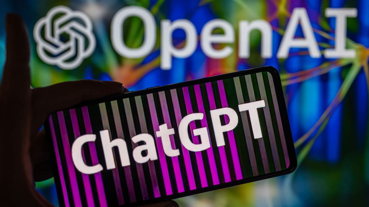 ChatGPT displayed on smartphone with OpenAI logo seen on screen in the background