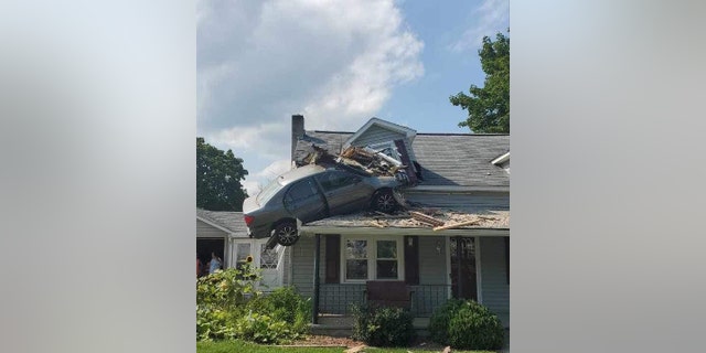 A car crashes into a home