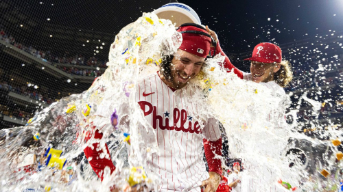Aug 9, 2023; Philadelphia, Pennsylvania, USA; Philadelphia Phillies starting pitcher Michael Lorenzen (22) is doused with water by first baseman Alec Bohm (28) after pitching a no hit victory against the Washington Nationals at Citizens Bank Park. Mandatory Credit: Bill Streicher-USA TODAY Sports