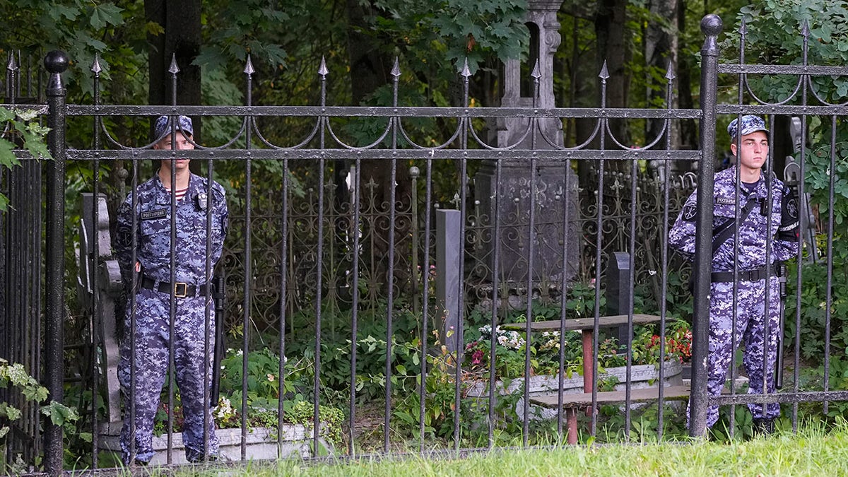 Russian police guard cemetery following Prigozhin burial