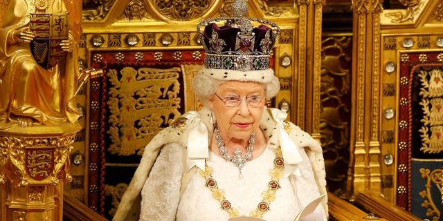 Queen Elizabeth II sits in full regal ensemble