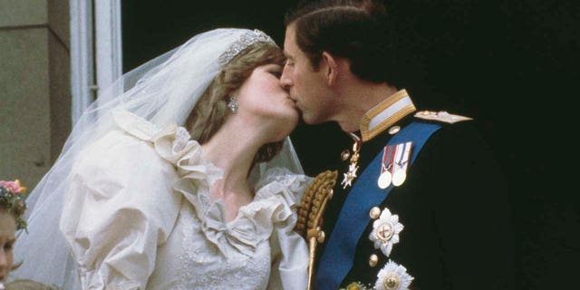 Prince Charles, Prince of Wales, kissing his wife, Princess Diana