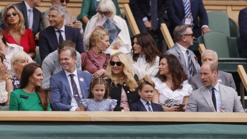 Charlotte (center left), and George (center right) sit in the Royal Box ahead of the men's singles Wimbledon final on Sunday.