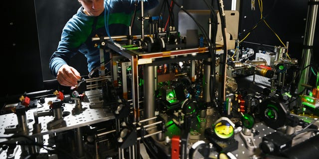man in a quantum computer lab with equipment