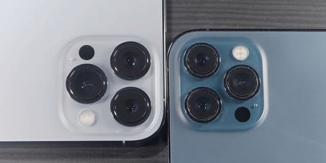 White iPhone cameras and blue iPhone cameras up close