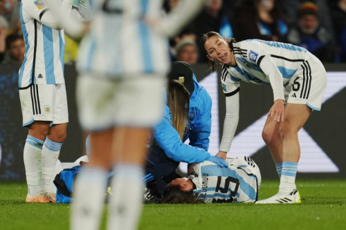 Argentina's Florencia Bonsegundo lies on the pitch after getting injured against Sweden.