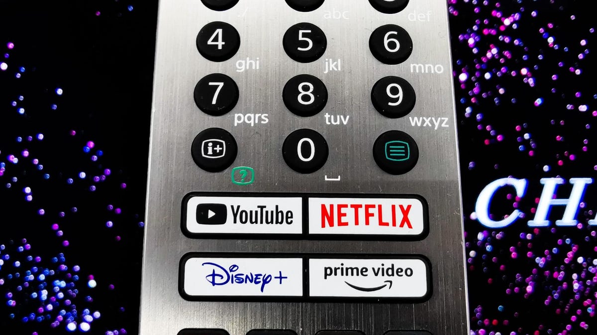 tv remote control showing streaming platform buttons