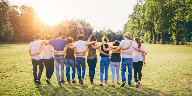 Group of friends with arms around each other
