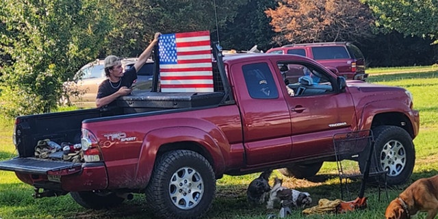 flag displayed in bed of pickup