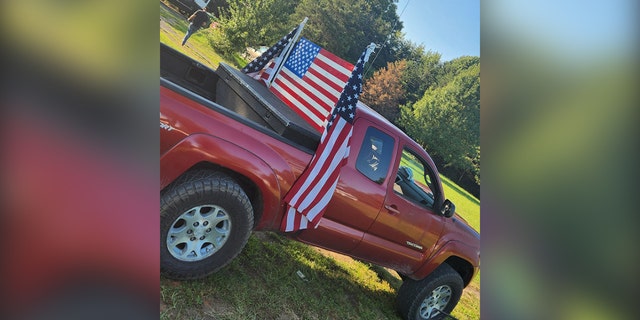 photo of flags on teenager's pickup