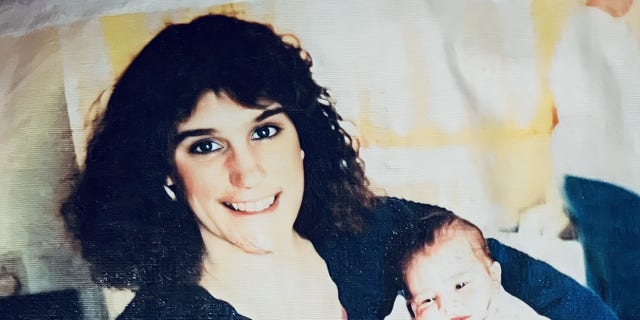 Deborah Mowrey-Marshall holding her daughter Catrina Marshall