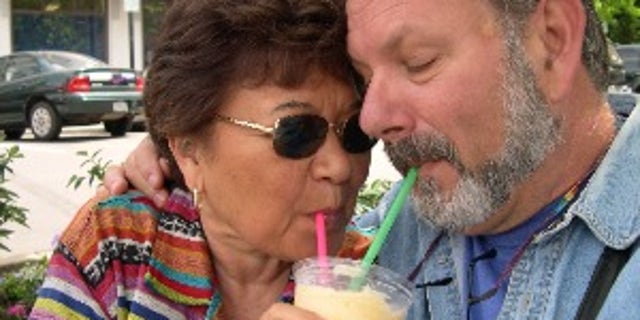 betty ann with husband sharing a drink