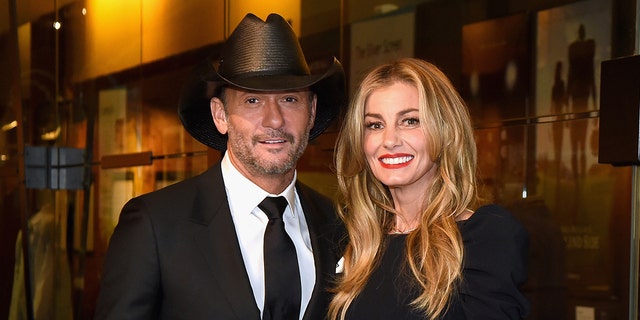 Faith Hill wears black dress to match husband Tim McGraw's black suit and cowboy hat