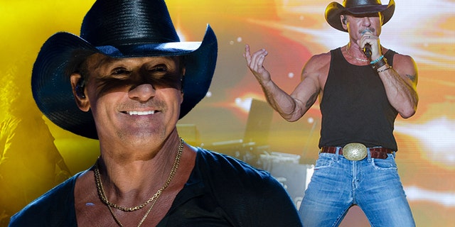 Tim McGraw wears signature black hat on stage during concert