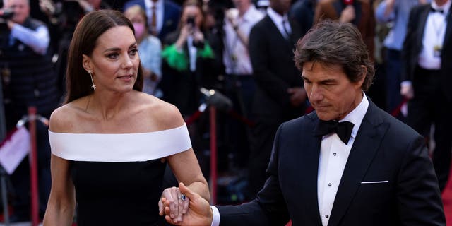 Kate Middleton walks down red carpet holding Tom Cruise's hand