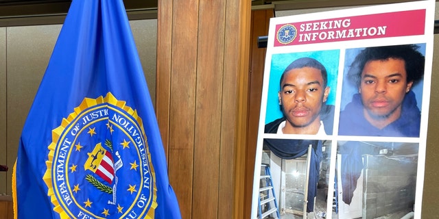 Photos of Negasi Zuberi shown on a poster during an FBI press conference