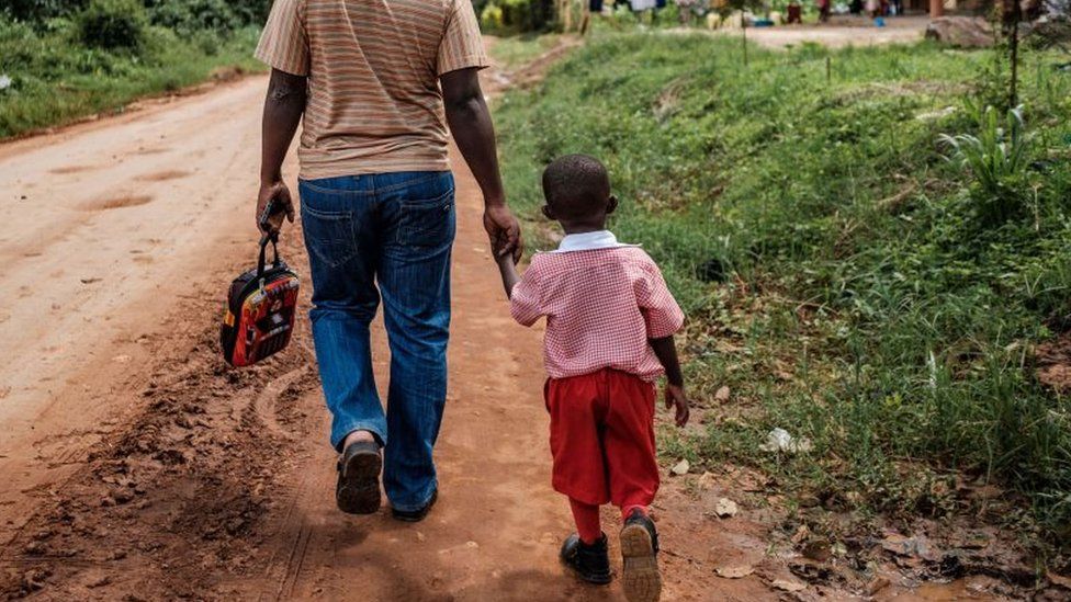 Father walks with child