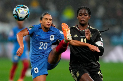 France's Estelle Cascarino, left, and Shaw battle for the ball.