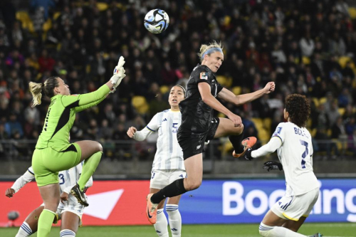 New Zealand's Hannah Wilkinson attempts to head the ball past Philippines goalkeeper Olivia McDaniel during their match on July 25.