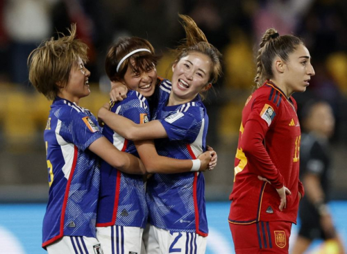 Japan's Hinata Miyazawa, second from left, celebrates scoring the team's third goal with Honoka Hayashi, left, and Risa Shimizu.