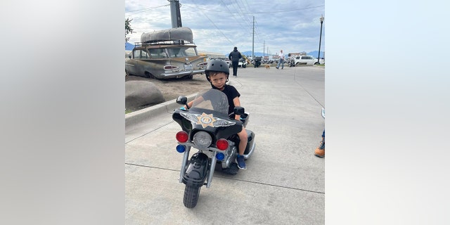 Jackson on toy motorcycle