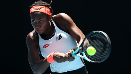 MELBOURNE, AUSTRALIA - JANUARY 22: Coco Gauff of the United States plays a backhand during the fourth round singles match against Jelena Ostapenko of Latvia during day seven of the 2023 Australian Open at Melbourne Park on January 22, 2023 in Melbourne, Australia. (Photo by Cameron Spencer/Getty Images)