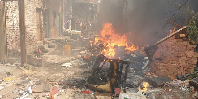 Chairs and other furniture and proprty is burned on the street in Pakistan